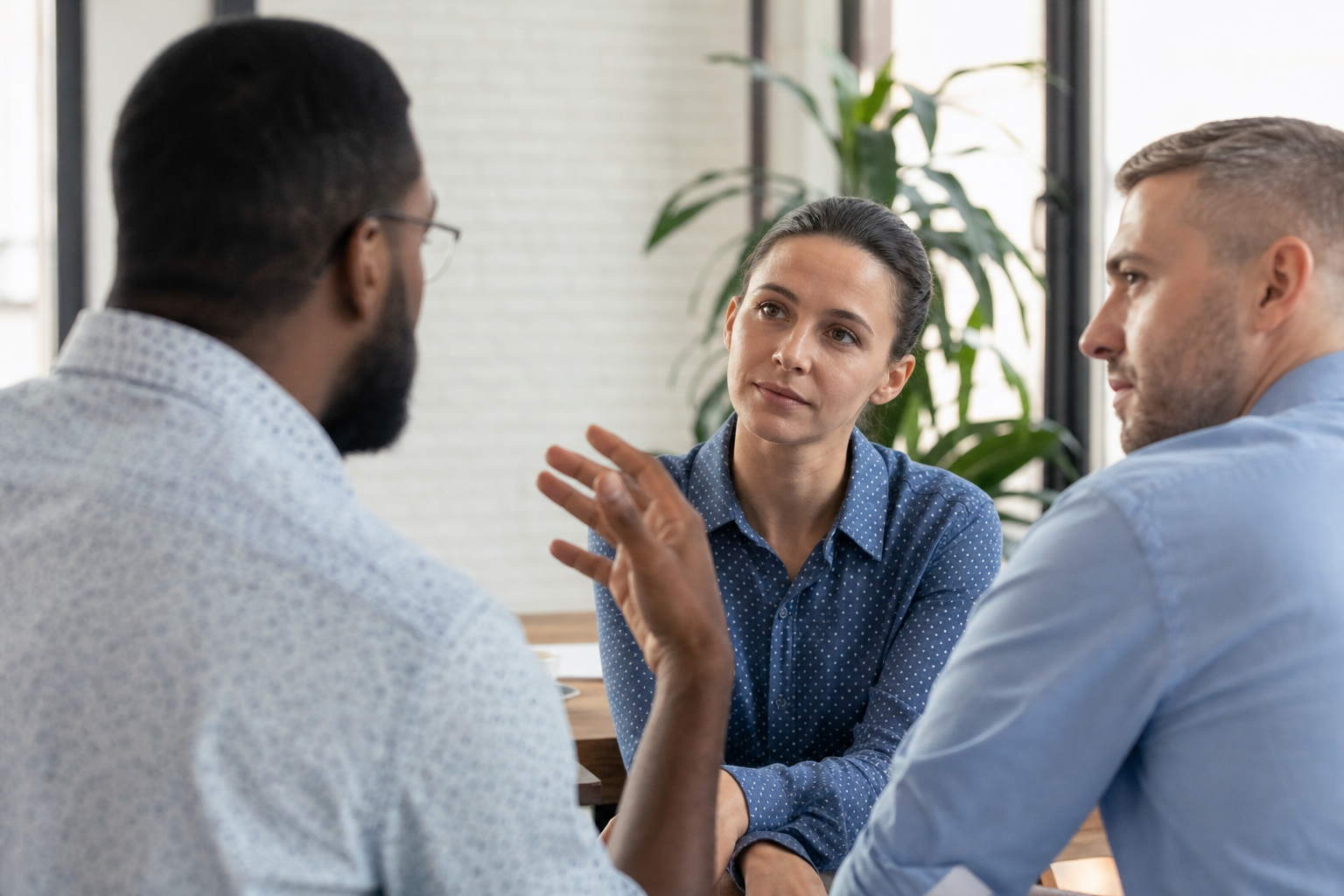 Adults in a calm group conversation with patient listening